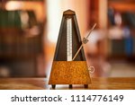Classic metronome in a room with warm tone