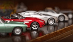 Classic Model Vehicles Or Toy Vehicles. Miniature Collection Of Automobiles. Retro Car Models On Shelf. Retro Style Cars. Toy Cars With Retro Design.