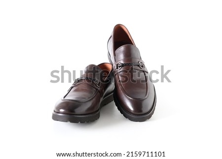 Classic modern male brown leather loafers shoes isolated on white background.