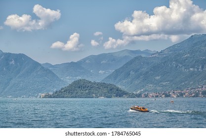 The Classic Motorboat Of Lake Como Approaches Villa Balbianello