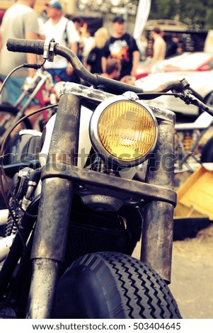 Similar – Senior man steering motorcycle on road