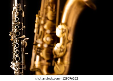 Classic music Sax tenor saxophone and clarinet in black background - Shutterstock ID 129096182