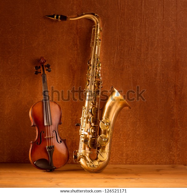 Classic music Sax tenor saxophone violin  in\
vintage wood background
