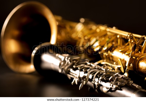 Classic music Sax tenor saxophone and clarinet\
in black background