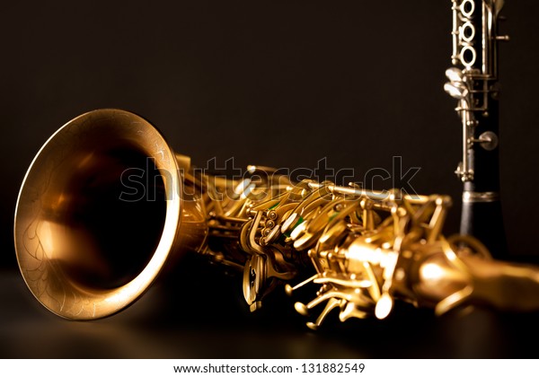 Classic music Sax tenor saxophone and clarinet\
in black background