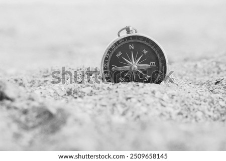 Classic navigation compass on natural background as symbol of tourism with compass, travel with compass and outdoor activities with compass