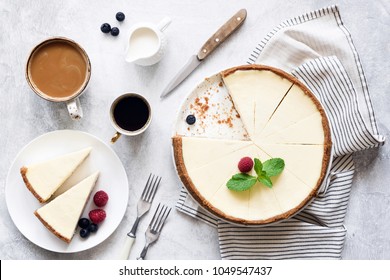 Classic New York Cheesecake And Coffee on White Concrete Background, Top View. Coffee and Cheesecake - Shutterstock ID 1049547437