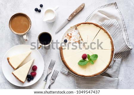 Classic New York Cheesecake And Coffee on White Concrete Background, Top View. Coffee and Cheesecake