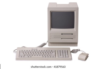 Classic Nineteen Eighties Apple Mac SE Desktop Personal Computer With Mouse And Keyboard On A White Background