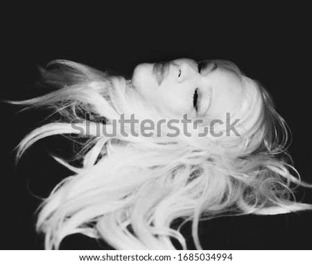 Similar – Profile portrait of a blonde and sad woman