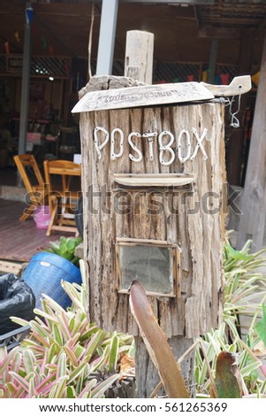 Classic old mailbox made from old wood in garden