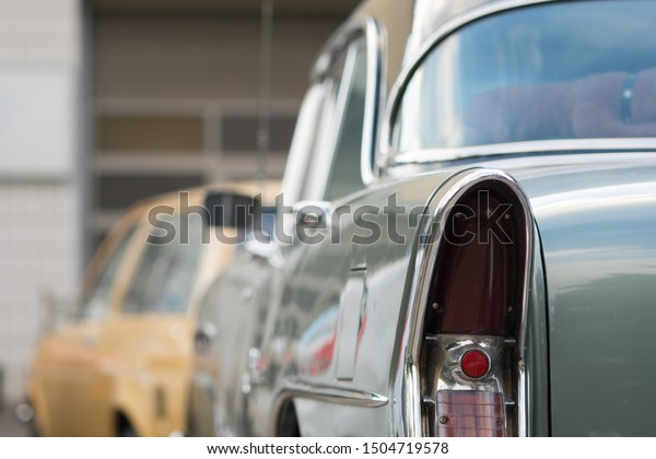 A\
classic old vintage auto body. Closeup of the rear view stop light.\
Concept of transportation and vintage\
lifestyle.