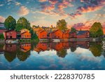 Classic old wood houses and their reflection in river, Porvoo Finland