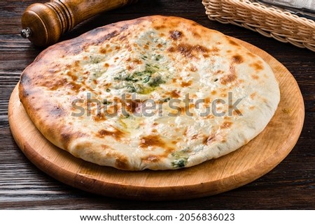 classic Ossetian pie with filling, homemade dietary ossetian pie with cabbage and brisket. National pastries Ossetian pies with different fillings Stock photo © 