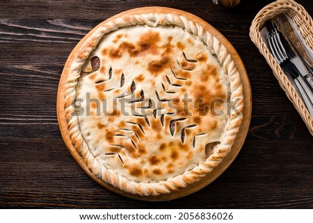 classic Ossetian pie with filling, homemade dietary ossetian pie with cabbage and brisket. National pastries Ossetian pies with different fillings Stock photo © 
