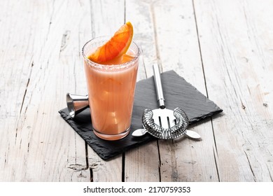 Classic Paloma Cocktail On White Wooden Table