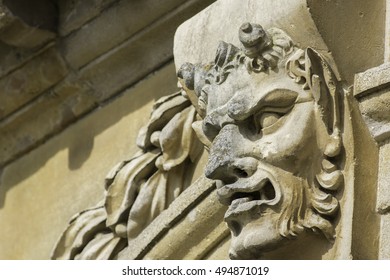 Classic Pan, or the devil, gargoyle feature carved in stone.