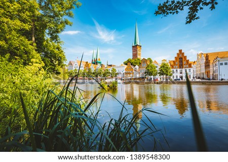 Classic panorama view of the historic city of Luebeck with famous Trave river in summer, Schleswig-Holstein, Germany