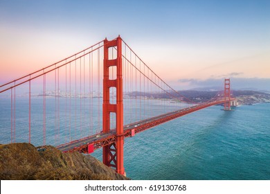 Classic panoramic view of famous Golden Gate Bridge seen from Battery Spencer viewpoint in beautiful post sunset twilight during blue hour at dusk in summer, San Francisco, California, USA