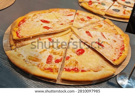 Classic ‘Margherita’ pizza, made with a thin base, tomato sauce and mozzarella.