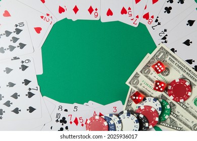 Classic Playing Cards, Chips, Red Dice And Dollars On Green Background With Place For Text. Gambling And Casino Concept. Flat Lay Design.