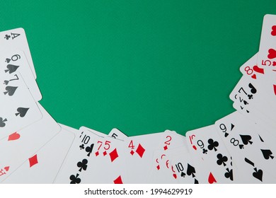 Classic Playing Cards On Green Background With Place For Text. Gambling And Casino Concept. Flat Lay Design.