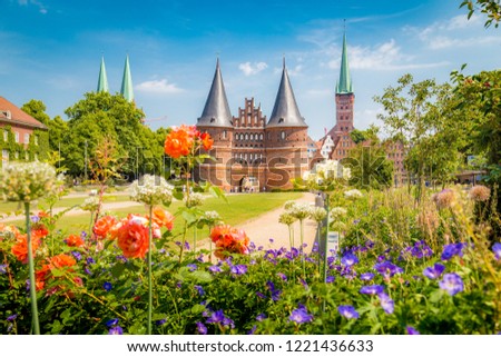 Classic postcard view of the historic town of Lübeck with famous Holstentor gate in summer, Schleswig-Holstein, northern Germany