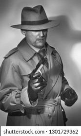 Classic private investigator carries a big loaded gun