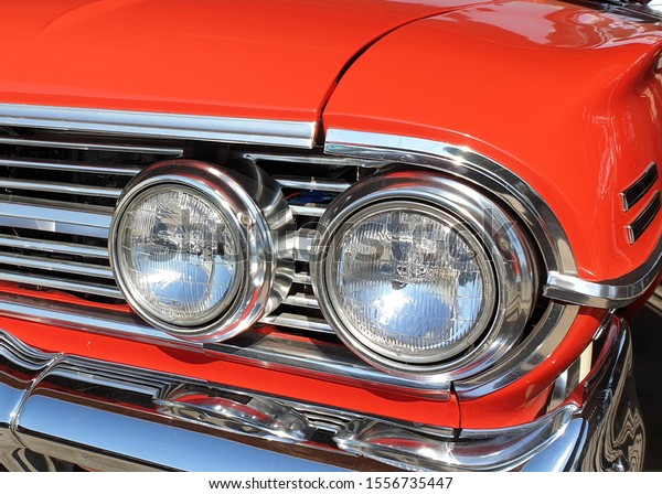 Classic red vehicle\
with front light\
details