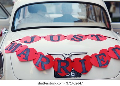 Classic Retro White Wedding Car With Red Hearts Sign, Just Married Text