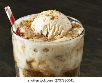 Classic Root Beer Float: an iconic American treat mixing fizzy root beer with creamy vanilla ice cream, cherished for its nostalgic sweetness and popularity at diners, summer parties celebrations
