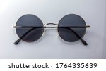 Classic round sunglasses on white background. circle sunglasses isolated