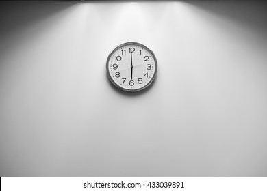 Classic round wall clock on the wall background, Black and White
