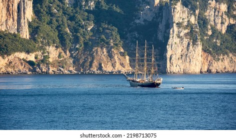 Classic Sailboat Anchored In The Bay At Sunrise