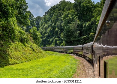 Classic Scenic Train Ride Coming Around A Track Curve