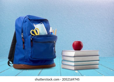 Classic school backpack with different school stationery on background - Shutterstock ID 2052169745