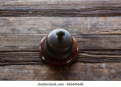 Classic Service Bell On Wooden Table By Top View