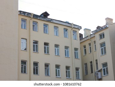 Classic Simple House Facade At Well Yard In Saint Petersburg, Russia. Famous City Courtyards Built In Shape Of A Well, With Small Space Between Building Facades. Modern City House Exterior.