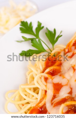 Classic spaghetti served with tomato sauche and cheese