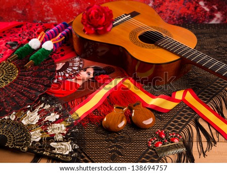 Classic spanish guitar with flamenco elements as comb fan and castanets