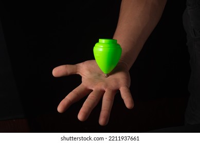 Classic Spinner Top Toy Close Up, Black Background