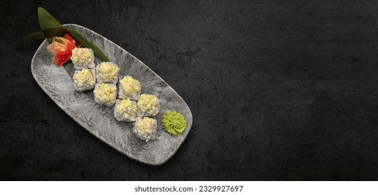 Classic sushi roll with seafood, soy sauce, wasabi and ginger. dark background, horizontal banner