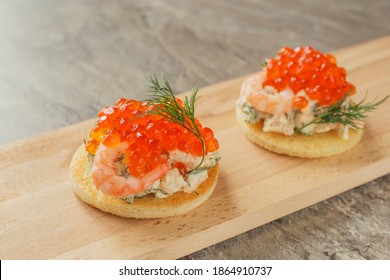 Classic Swedish Appetizer - Sandwiches With Shrimps And Caviar On Wooden Board On Dark Table. Toast Skagen Ready To Eat. Selective Focus.Tasty And Healthy Food. 