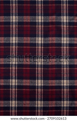 Classic tartan pattern in deep red, navy blue, and cream with a timeless design, perfect for cozy decorations and fashion