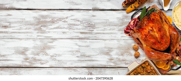 Classic Thanksgiving Turkey Dinner Close Up. Above View Side Border On A Rustic White Wood Banner Background With Copy Space.