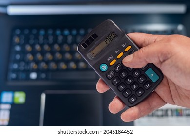 Classic Typical Black Calculator. Economy And Accounting Symbol. Mathematics And Accurate Calculations. Maintaining A Family Budget. Background With Copy Space For Text Or Lettering