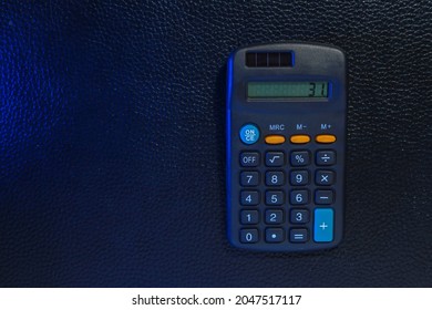 Classic Typical Black Calculator. Economy And Accounting Symbol. Mathematics And Accurate Calculations. Maintaining A Family Budget. Background With Copy Space For Text Or Lettering