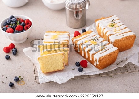 Classic vanilla pound cake with powdered sugar glaze sliced on parchment paper Stock photo © 
