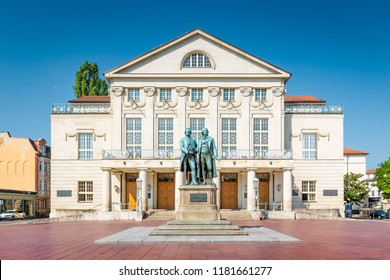 Classic view of famous Deutsches Nationaltheater with Goethe-Schiller monument on a beautiful sunny day with blue sky in Weimar, Thuringia, Germany