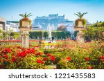 Classic view of famous Mirabell Gardens with historic Hohensalzburg Fortress in the background on a sunny day in fall in Salzburg, Austria